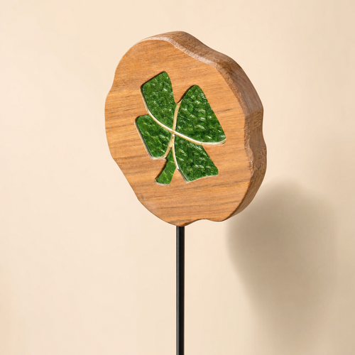 One Mirthwick stained-glass clover garden stake shown clearly against a warm ivory background